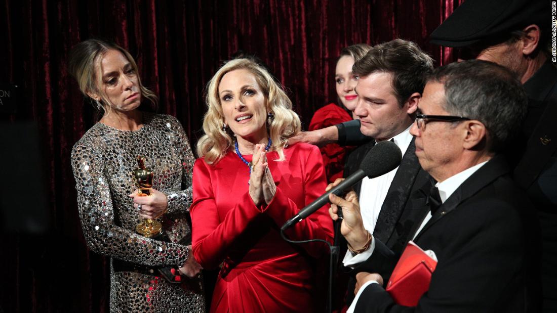 The cast and crew of &quot;CODA&quot; are seen backstage after winning best picture. From left are director Sian Heder and actors Marlee Matlin, Amy Forsyth, Daniel Durant and Troy Kotsur.