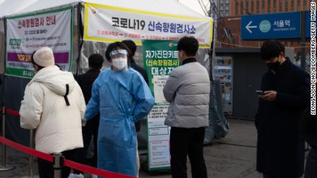 The public wait in line at a temporary Covid-19 testing station set up outside Seoul Station on March 4, 2022.