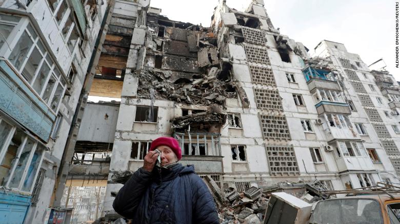 Local resident Valentina Demura, 70, next to the building where her apartment was destroyed in Mariupol, on March 27.