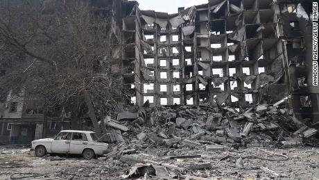 Collapsed building is seen as civilians are evacuated along humanitarian corridors from the Ukrainian city of Mariupol under the control of Russian military and pro-Russian separatists, on March 26, 2022. 