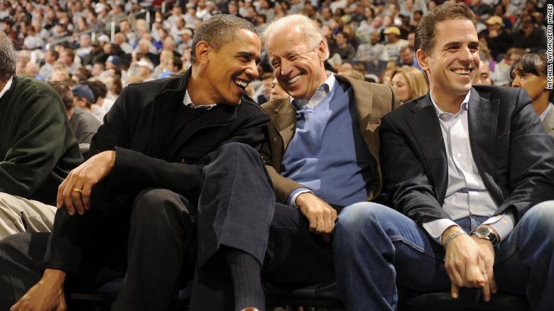 Then-President Barack Obama and then-Vice President Joe Biden and Hunter Biden (son of Joe Biden) talk during a college basketball game between Georgetown Hoyas and the Duke Blue Devils on January 30, 2010 at the Verizon Center in Washington DC.  