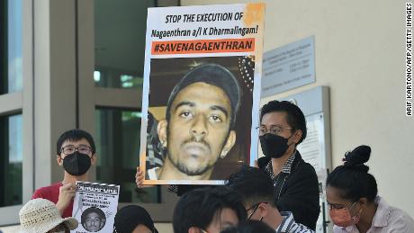 Activists hold posters displaying messages against the execution of Nagaenthran K. Dharmalingam, who was sentenced to death for trafficking heroin into Singapore, outside the Singapore High Commission in Kuala Lumpur on March 9.