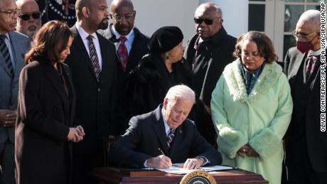 Biden signs bill to put federal hate crimes into law