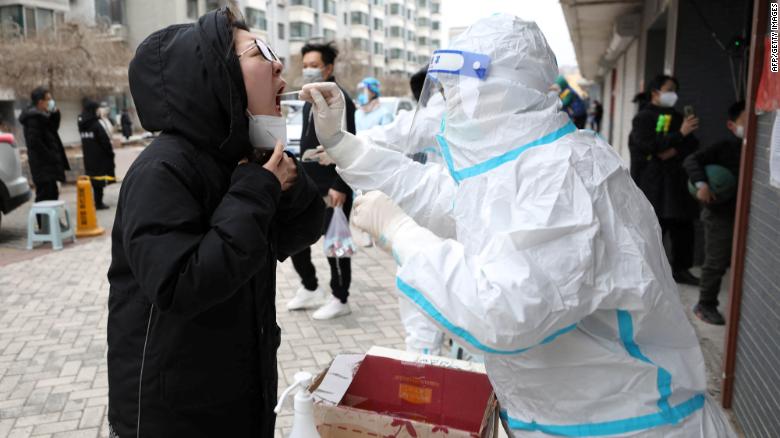 A resident undergoes a nucleic acid test for the Covid-19 coronavirus in Shenyang, in China's northeastern Liaoning province on March 29, 2022. - China OUT (Photo by AFP) / China OUT (Photo by STR/AFP via Getty Images)