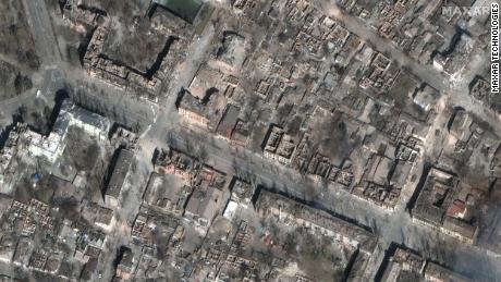 A satellite photo shows entire city blocks destroyed in central Mariupol.