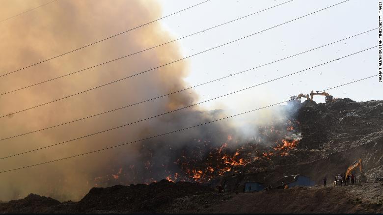 Indian firefighters battle Delhi landfill blaze as air fills with toxic fumes