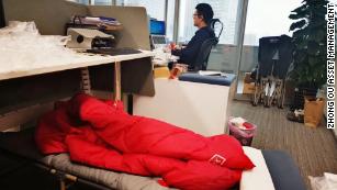 Traders sleep by their desks as China&#39;s financial hub locks down