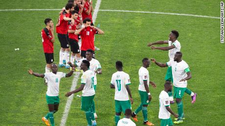 Senegal&#39;s players celebrate during a penalty shootout against Egypt. 