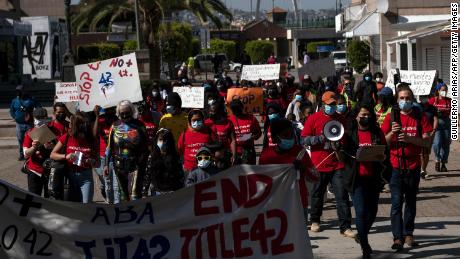 Migrants and asylum seekers march in Tijuana to protest the Title 42 policy on March 21.