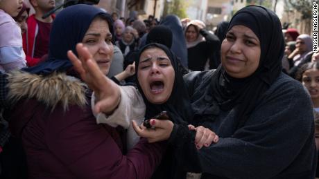 Palestinian Hadeel Abu Atiyeh cries at the funeral of her brother Sanad Abu Atiyeh in the West Bank on March 31.