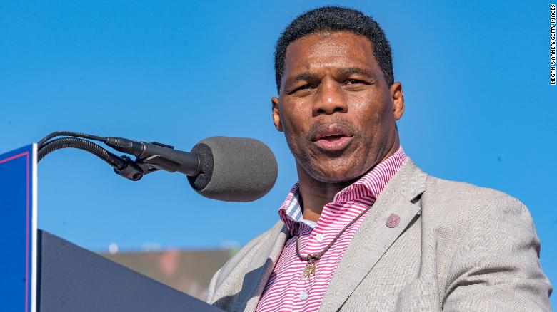 Former Heisman Trophy winner and candidate for US Senate Herschel Walker (R-GA) speaks to supporters of former President Donald Trump during a rally on March 26, 2022 in Commerce, Georgia. 