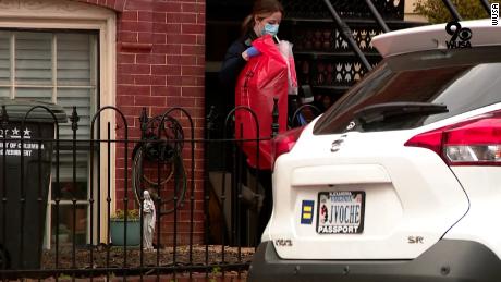 Police were seen removing evidence from the rowhouse in red biohazard bags and coolers.