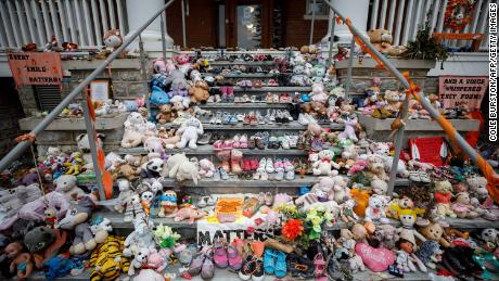 Children&#39;s shoes and stuffed animals sit on the steps as a tribute to the missing children of the former Mohawk Institute Residential School in Brantford, Canada, last November. Crews were searching for more unmarked graves of students near Toronto. 