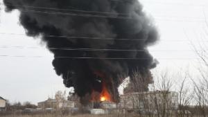 A view shows a fuel depot on fire behind buildings in the city of Belgorod, Russia April 1, 2022. Pavel Kolyadin/BelPressa/Handout via REUTERS ATTENTION EDITORS - THIS IMAGE HAS BEEN SUPPLIED BY A THIRD PARTY. NO RESALES. NO ARCHIVES. MANDATORY CREDIT.