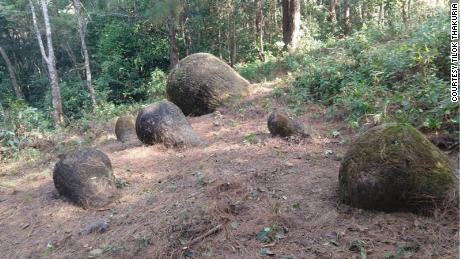 About 65 stone jars were discovered partially unearthed in northeastern India.
