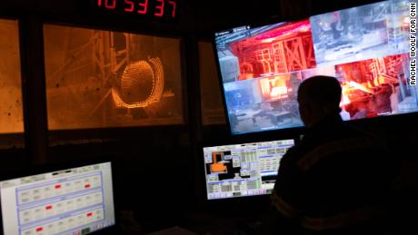 A worker mans the control room at the Evraz steel mill in Pueblo.
