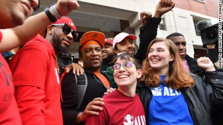 Union organizer Christian Smalls (L) celebrates following the April 1, 2022, vote for the unionization of the Amazon Staten Island warehouse in New York.