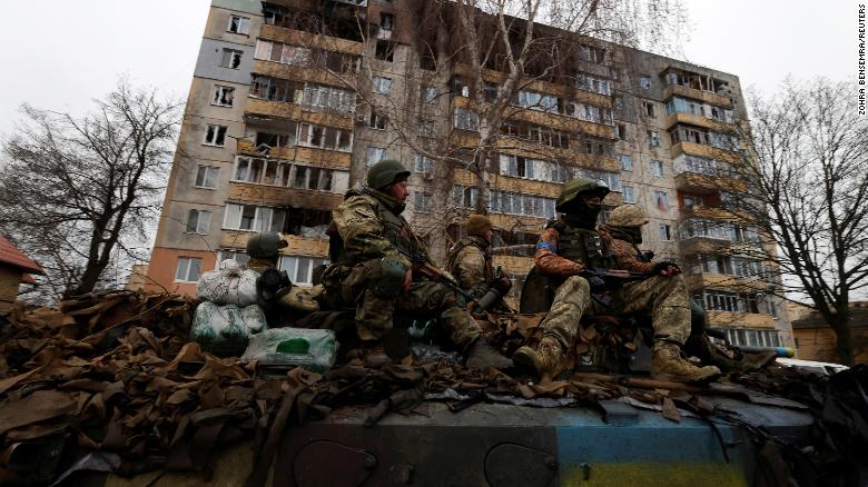 Ukrainian soldiers are pictured in Bucha on Saturday, after Russian troops retreated from the area. 