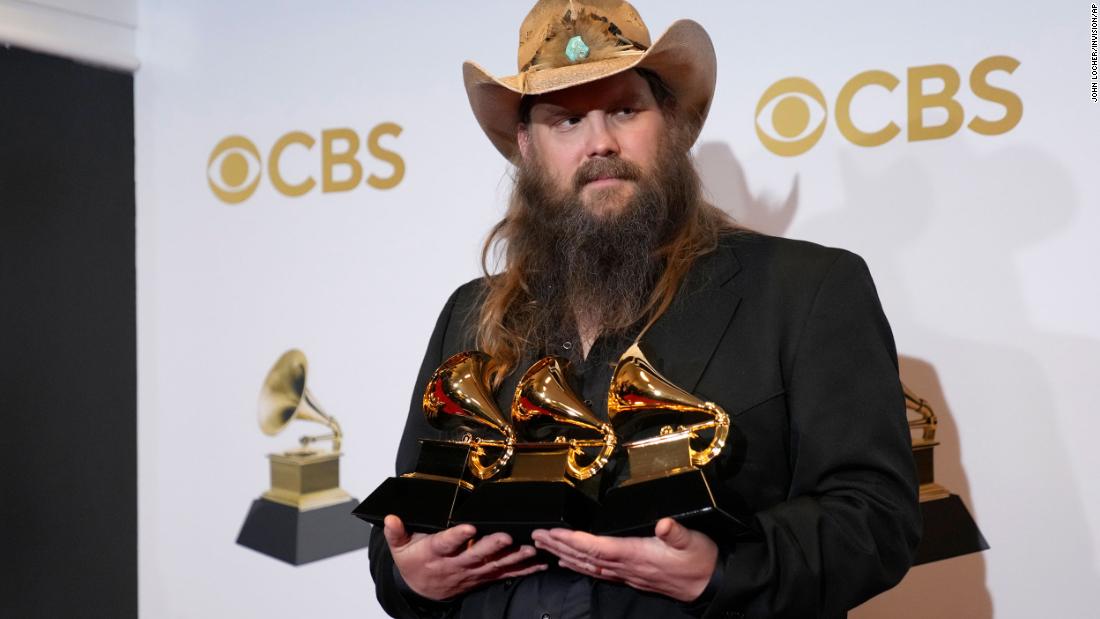 Chris Stapleton holds several of his Grammys in the press room. He won best country album (&quot;Starting Over&quot;), best country song (&quot;Cold&quot;), and best country solo performance (&quot;You Should Probably Leave&quot;).