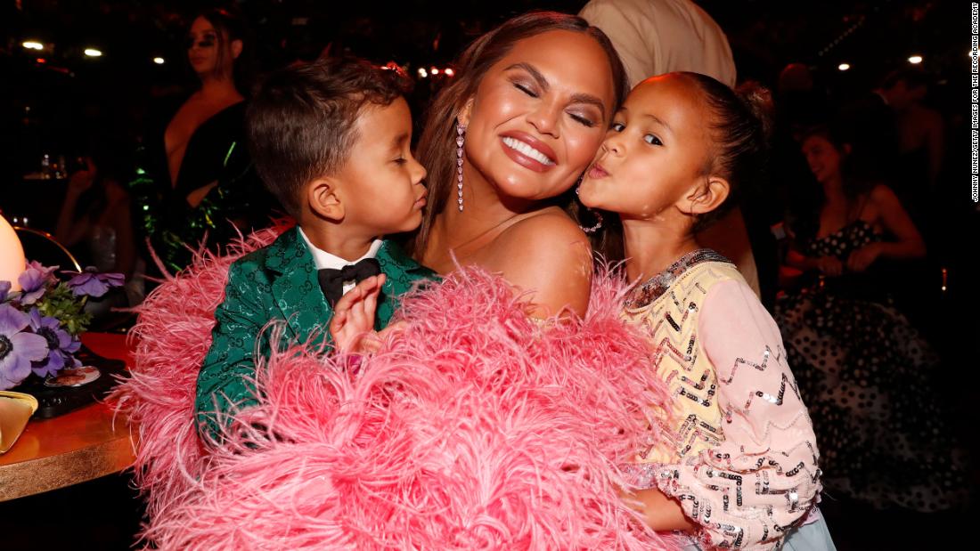 Chrissy Teigen attends the show with her children, Miles and Luna.
