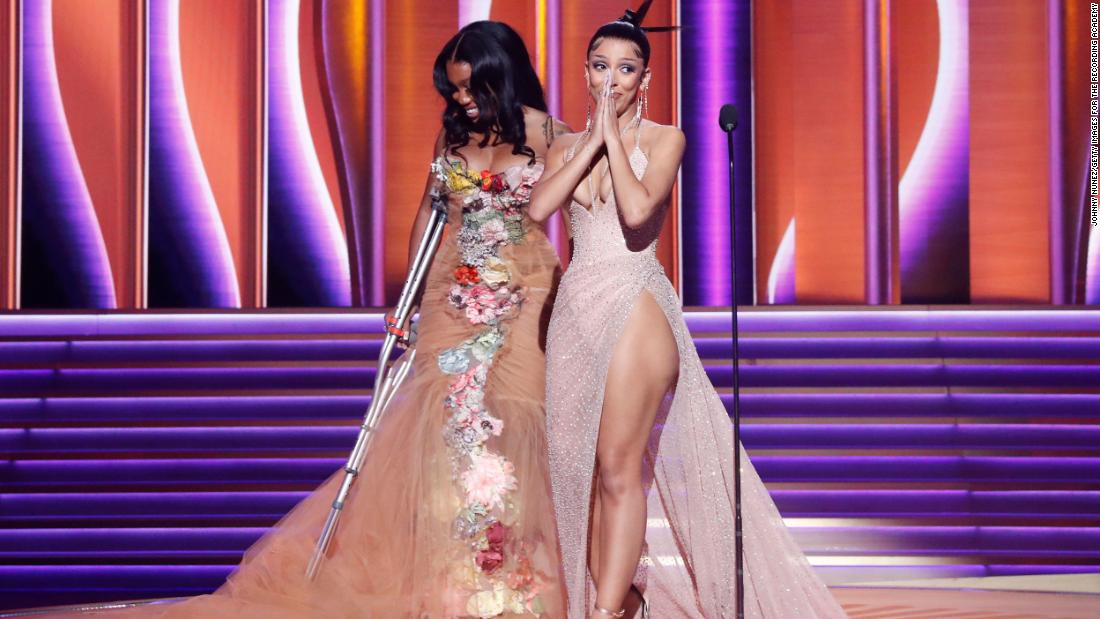 SZA, left, and Doja Cat accept the Grammy for best pop duo/group performance (&quot;Kiss Me More&quot;). Doja Cat joked about how she just barely made it back from the bathroom on time. 