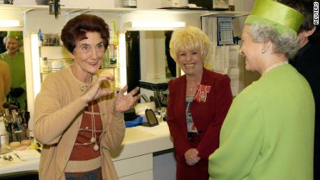 Queen Elizabeth II meets &quot;EastEnders&quot; stars June Brown (left) and Barbara Windsor during her visit to the soap&#39;s set in London on  November 28, 2001.