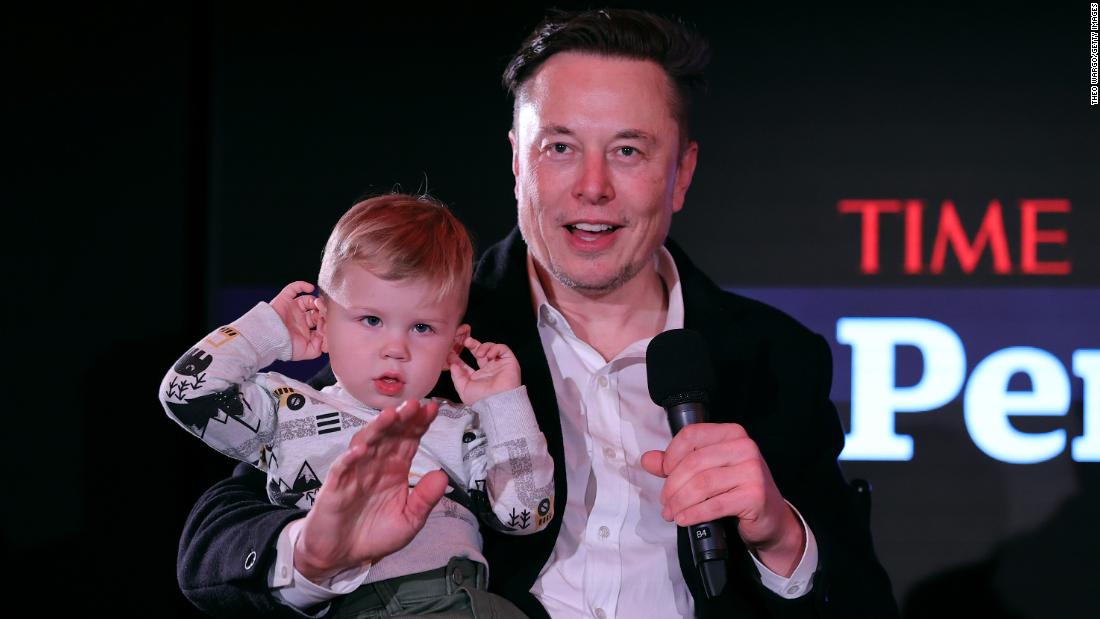Musk holds his son at Time magazine&#39;s Person of the Year Awards in December 2021. Time editor-in-chief Edward Felsenthal described Musk as &quot;a person with extraordinary influence on life on Earth — and potentially life off Earth, too.&quot;