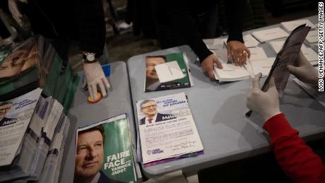 Public servants prepare election materials to be mailed to voters, less than a week out from the first round of France&#39;s presidential vote.