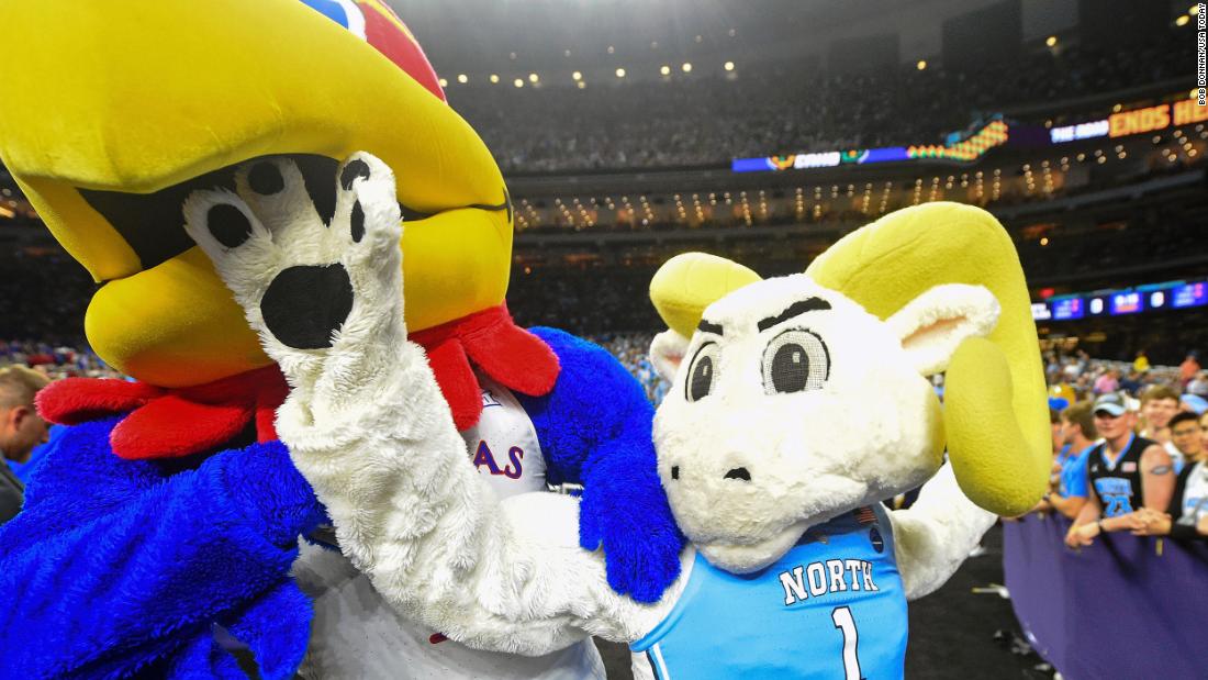 The two teams&#39; mascots play around before the game.