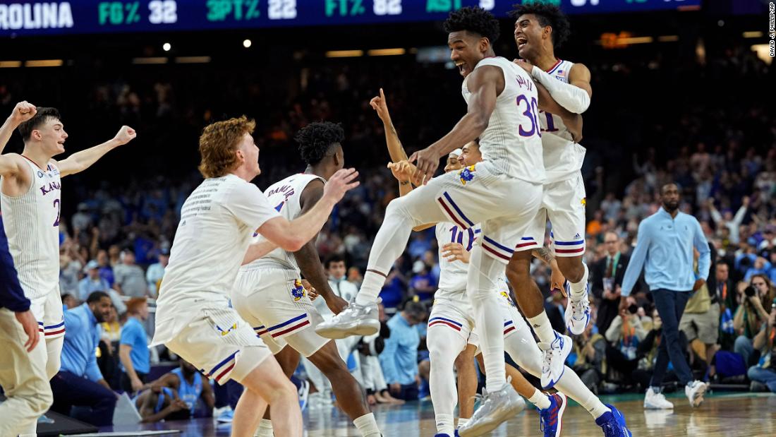 Kansas players celebrate after winning the national championship game against North Carolina on Monday, April 4.