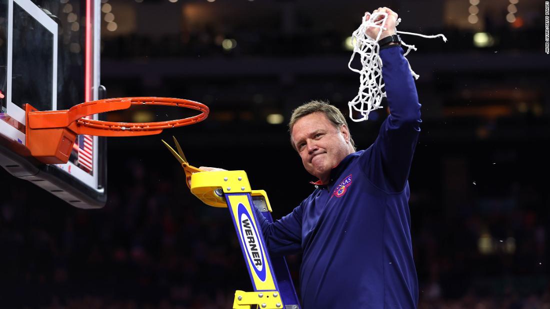 Kansas head coach Bill Self cuts down the net after the game. This is Self&#39;s second national title as head coach of the Jayhawks.