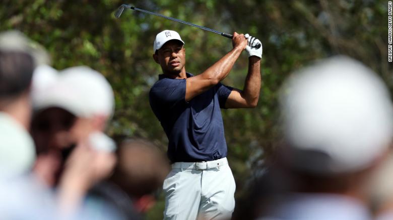 Woods takes a practice swing on the fourth tee during a practice round prior to the Masters.
