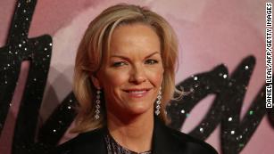 Elisabeth Murdoch, daughter of News Corp Chief Rupert Murdoch, poses for pictures on the red carpet upon arrival to attend the British Fashion Awards 2016 in London on December 5, 2016. 