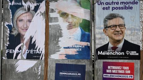 A picture taken on March 31, 2022 shows posters of far-right Party (RN) presidential candidate Marine Le Pen (L), far-right Party (Reconquete) presidential candidate Eric Zemour (C) and left-wing candidate Jean-Luc Mélenchon (La France Insoumise) in Montpellier. - March 28, 2022 marked the start of the official campaign period running up to the first round of voting on April 10, with all 12 candidates now entitled to equal time and space in the domestic media. The top two candidates in the first round will go through to a run-off on April 24. (Photo by Pascal GUYOT / AFP) (Photo by PASCAL GUYOT/AFP via Getty Images)