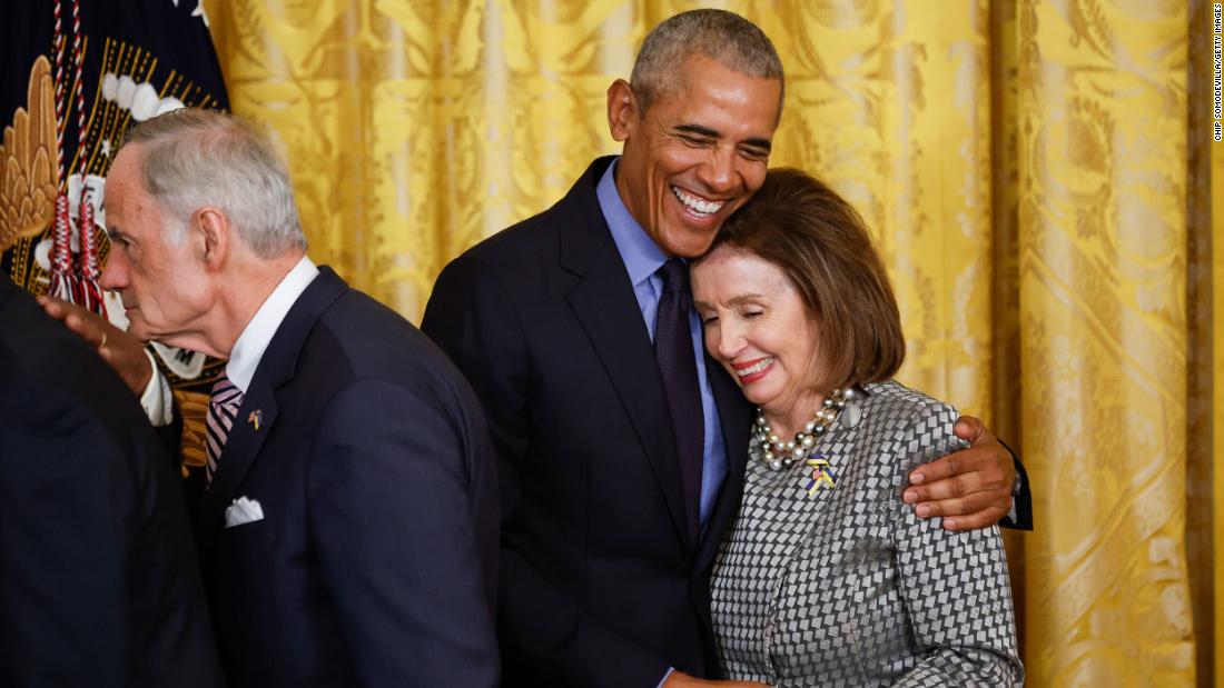 Obama hugs House Speaker Nancy Pelosi at the end of the event Monday.