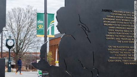 A plaque honoring James, an enslaved young man, is seen during the dedication of the Enslaved People of George Mason Memorial in Wilkins Plaza at George Mason University in Fairfax, Virginia, on Monday.