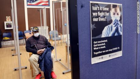 Army Veteran Robert Hall Waits the recommended 15 minutes to see if he will have any adverse reactions after receiving his second Covid-19 booster shot at Edward Hines Jr. VA Hospital on April 1 in Hines, Illinois. 