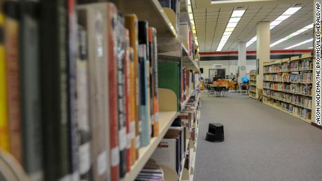 Books line the shelves of a high school library in Brownsville, Texas, on Monday, October 1, 2018.