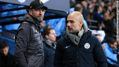 Klopp (L) and Guardiola (R) have been coy in press conferences regarding their side&#39;s title chances.