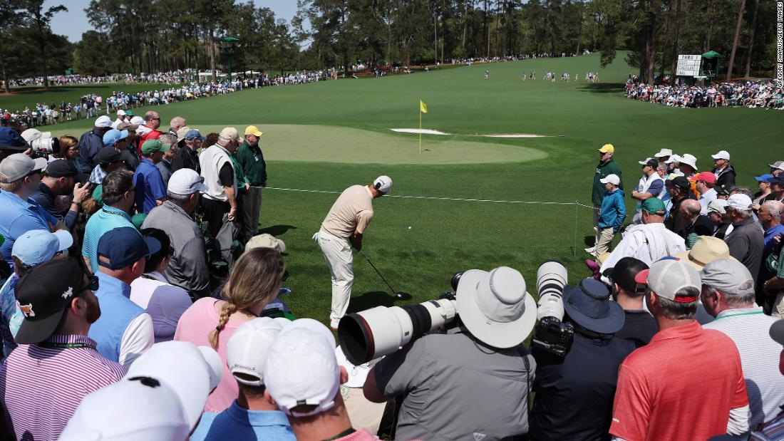 Former Masters champion Adam Scott plays a shot on the second hole Thursday.