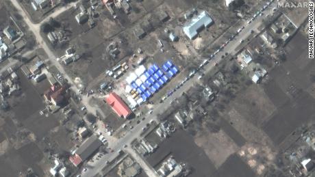 Maxar satellite images show a tent camp in Bezimen on March 22.