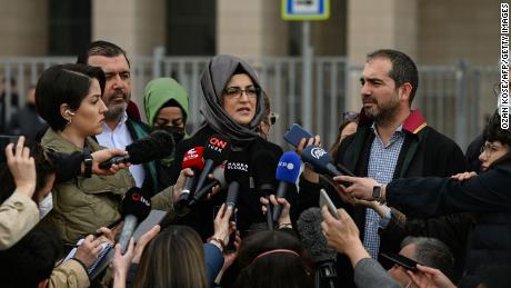 Hatice Cengiz, the fiancee of slain Saudi critic Jamal Khashoggi, answers journalists' questions outside an Istanbul court on April 7.  The court confirmed the suspension of the trial in the absence of 26 suspects linked to Khashoggi's murder and the transfer of the trial to Saudi Arabia.  Cengiz said that she would appeal the decision of the Turkish court.  Khashoggi, a 59-year-old journalist, was murdered inside the Saudi Arabian consulate in Istanbul on October 2, 2018 in a gruesome murder that shocked the world.