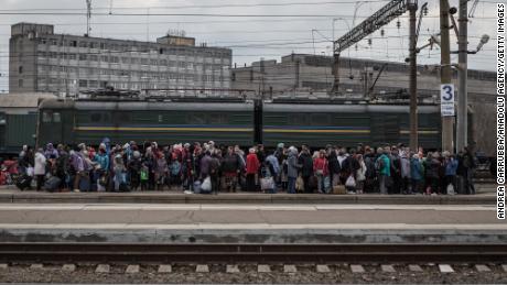 Citizens gather at Krematoresk station to be evacuated from war zones in eastern Ukraine on 6 April.