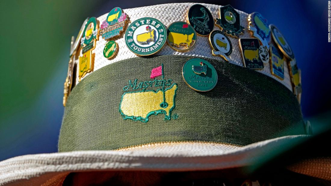 Masters pins adorn a fan&#39;s hat on Friday.