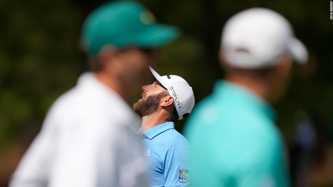Dustin Johnson, the 2020 Masters champion, reacts to a missed putt on the seventh hole Friday.