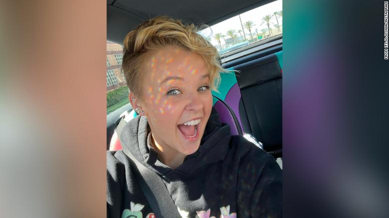 JoJo Siwa cuts off her signature ponytail and debuts a new look