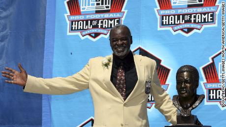 Rayfield Wright of the Dallas Cowboys poses with his bust after his induction during the Class of 2006 Pro Football Hall of Fame Enshrinement Ceremony.
