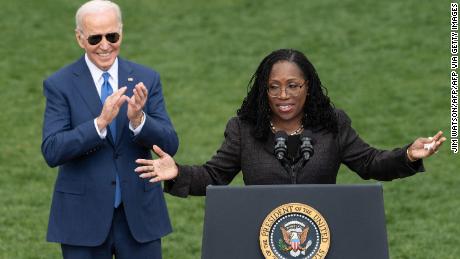 Judge Ketanji Brown Jackson speaks as US President Joe Biden reacts at an event celebrating Jackson&#39;s confirmation to the US Supreme Court on the South Lawn of the White House on April 08, 2022 in Washington, DC. (Photo by Jim WATSON / AFP) (Photo by JIM WATSON/AFP via Getty Images)