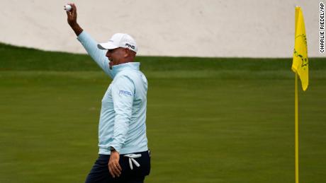 Cink holds up his ball after a hole-in-one on the 16th hole during the second round at the Masters.