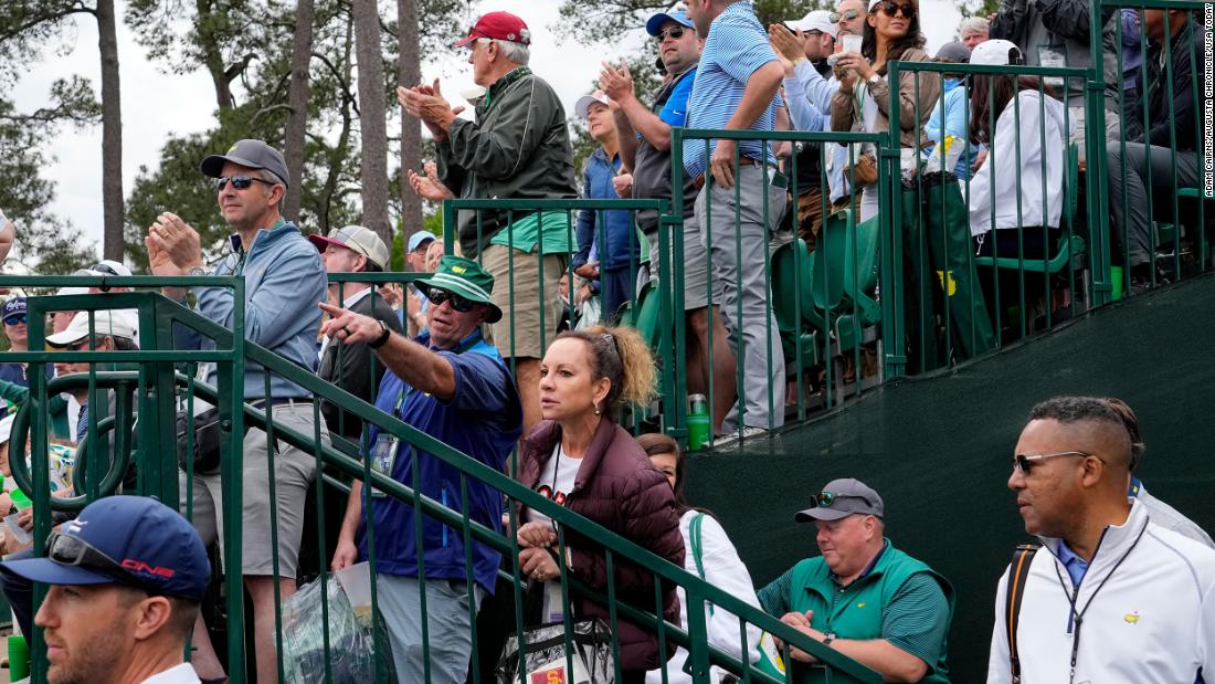 Fans get a glimpse of Woods as he approaches the 11th green on Friday.